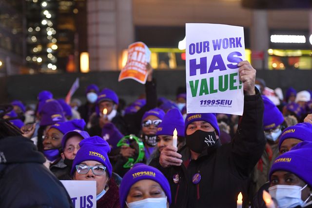 Workers from 1199 SEIU attend the 'Together We Stand March and Rally For Nursing Home Heros' on November 17, 2021 in Times Square.